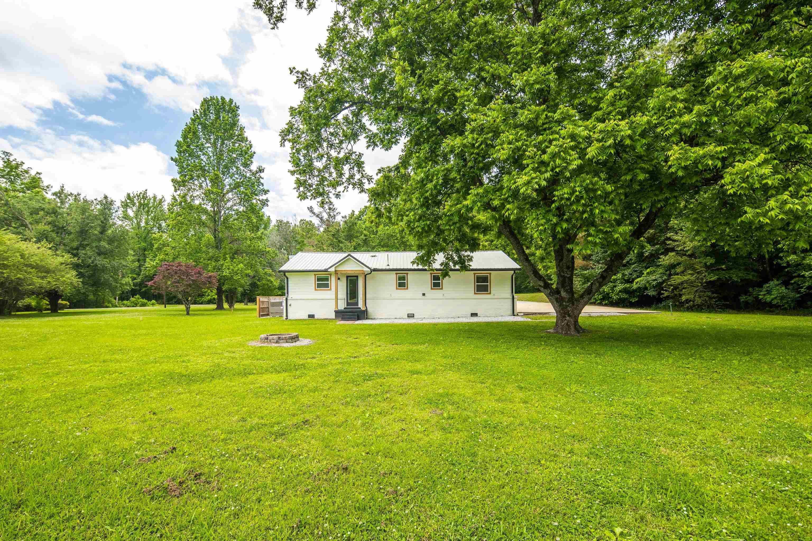 240 Dogwood Road Somerville, TN 38068 - Photo 30 of 37 a front view of a house with a garden