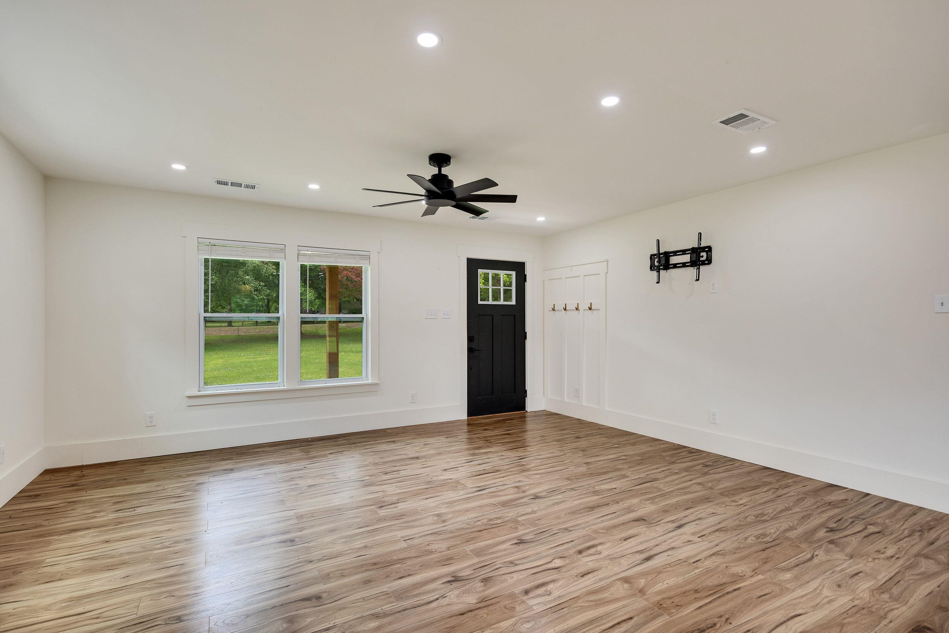 240 Dogwood Road Somerville, TN 38068 - Photo 7 of 37 a view of an empty room with a window and wooden floor