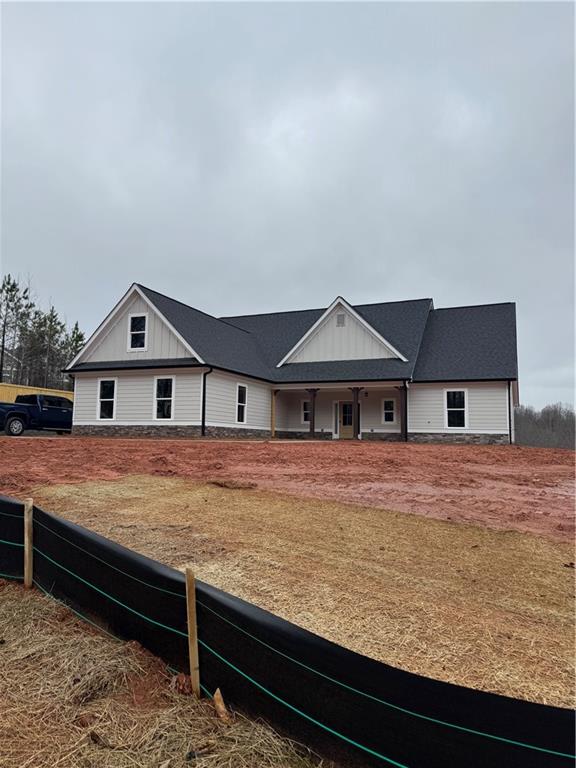 647 Fairview Road Pendergrass, GA 30567 - Photo 2 of 34 a big room with wooden floor and a yard