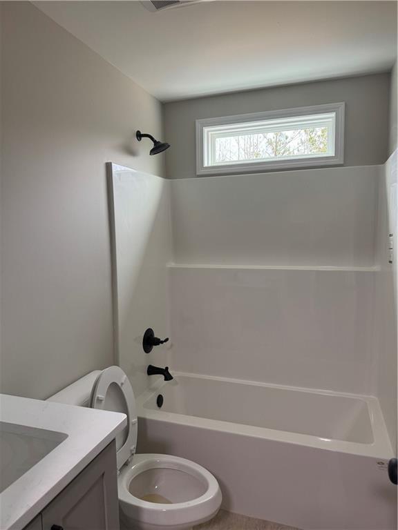 647 Fairview Road Pendergrass, GA 30567 - Photo 23 of 34 a bathroom with a granite countertop sink toilet and bathtub