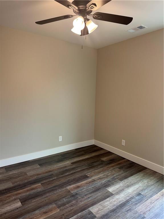 647 Fairview Road Pendergrass, GA 30567 - Photo 25 of 34 a view of an empty room with wooden floor