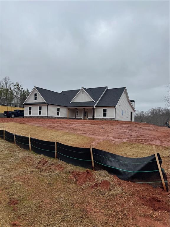 647 Fairview Road Pendergrass, GA 30567 - Photo 3 of 34 a backyard of house with wooden floor