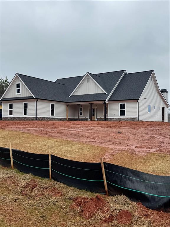647 Fairview Road Pendergrass, GA 30567 - Photo 4 of 34 a house view with a garden space