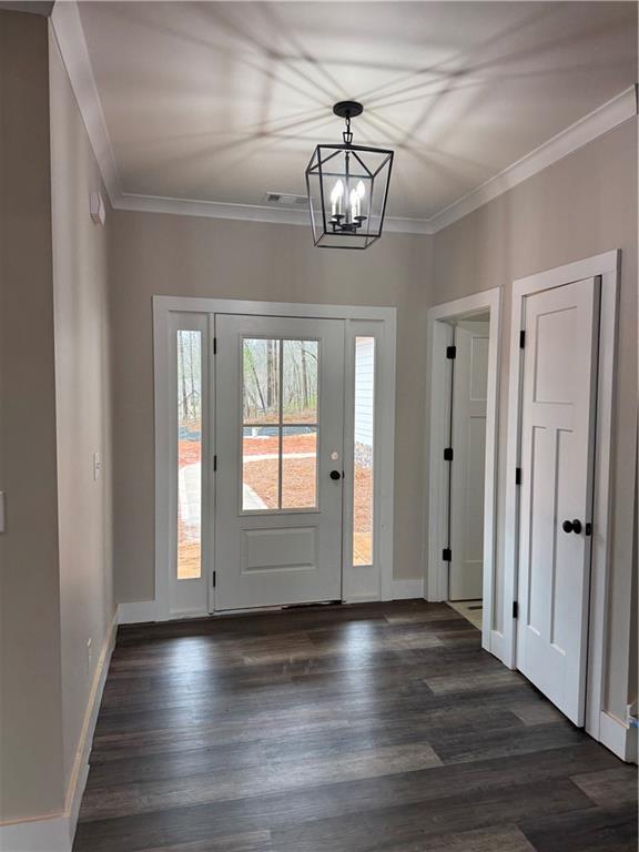 647 Fairview Road Pendergrass, GA 30567 - Photo 8 of 34 a view of empty room with wooden floor and fan