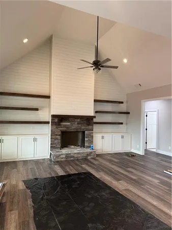 a view of a kitchen with a sink and a fireplace