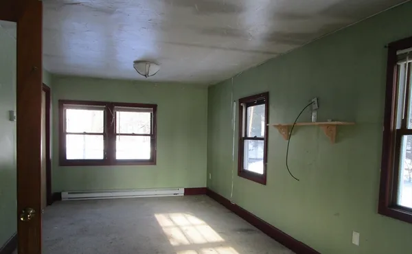 a view of an empty room with a window