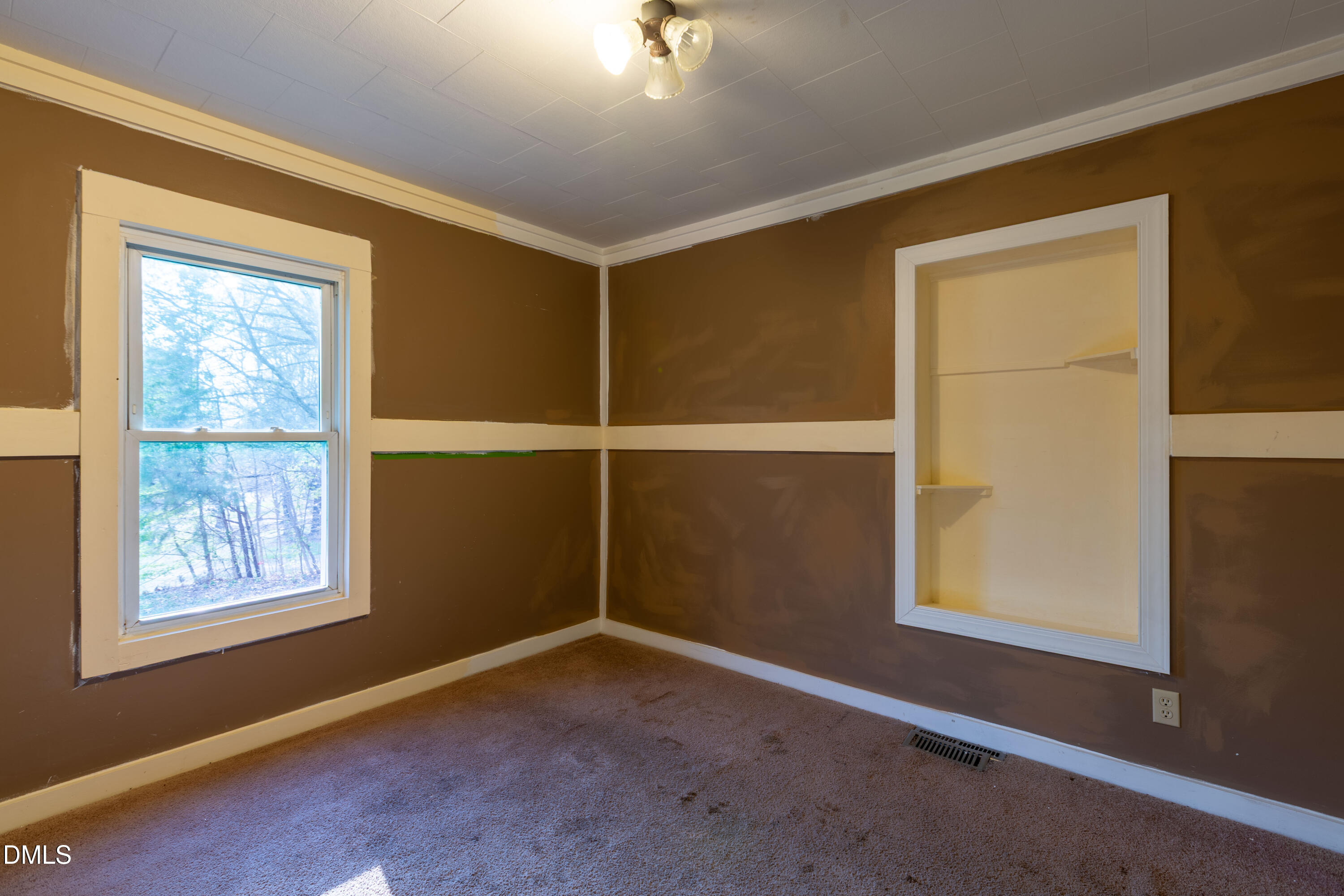 4295 Virgilina Road Roxboro, NC 27574 - Photo 11 of 46 an empty room with windows
