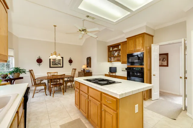 a kitchen that has a table and chairs in it