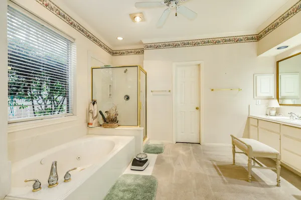 a bathroom with a tub shower and sink