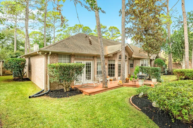 a view of a house with backyard porch and sitting area