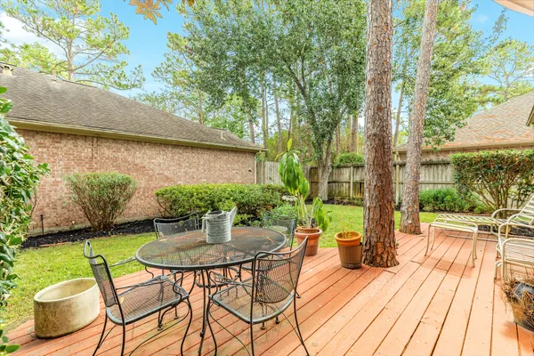 a view of a table and chairs in patio of a house