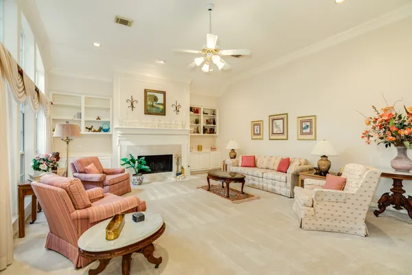 a living room with furniture and a fireplace