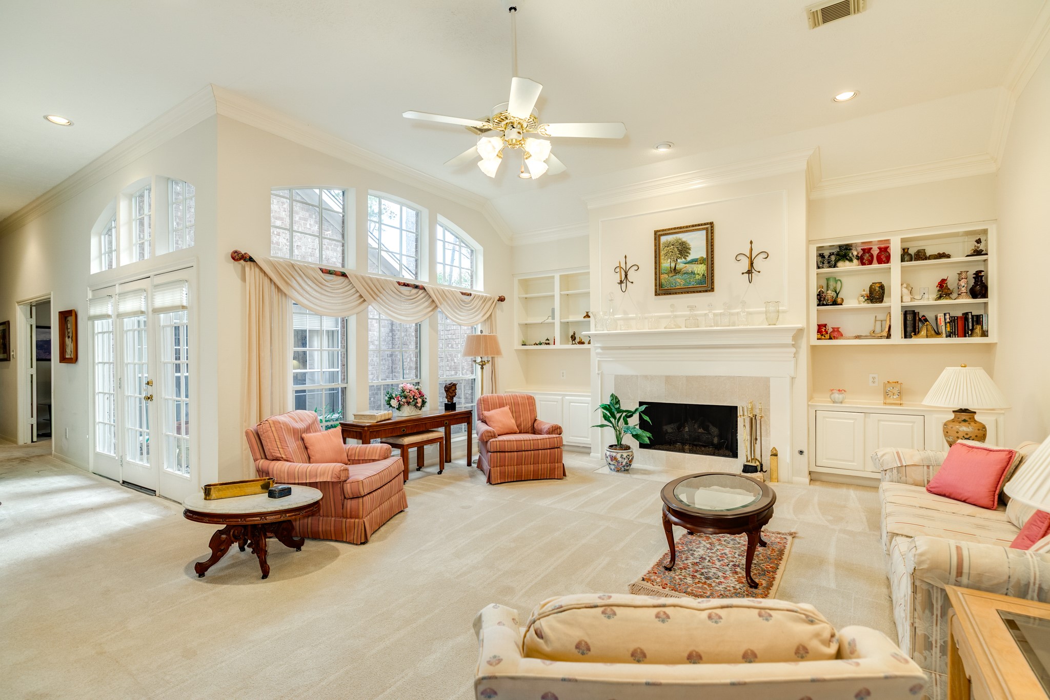 16522 Shadow Path Drive Pasadena, TX 77059 - Photo 6 of 33 a living room with furniture a fireplace and a chandelier