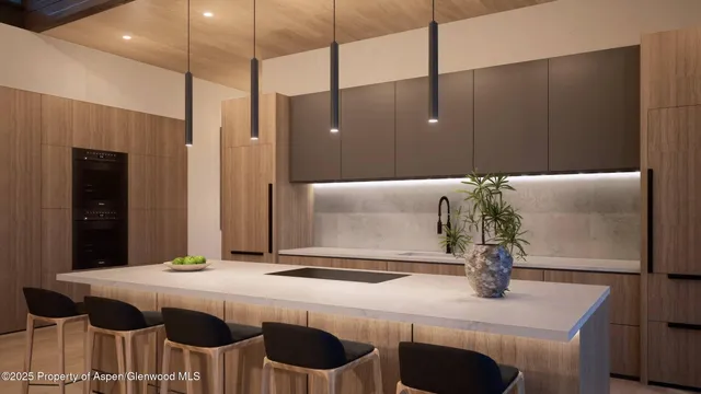 a kitchen with a table and chairs