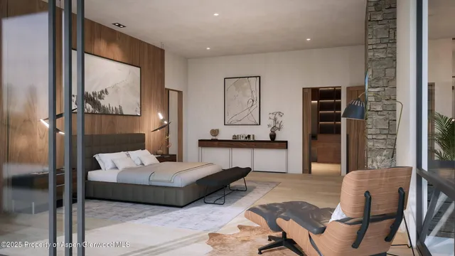 a bedroom with a large bed and a fireplace