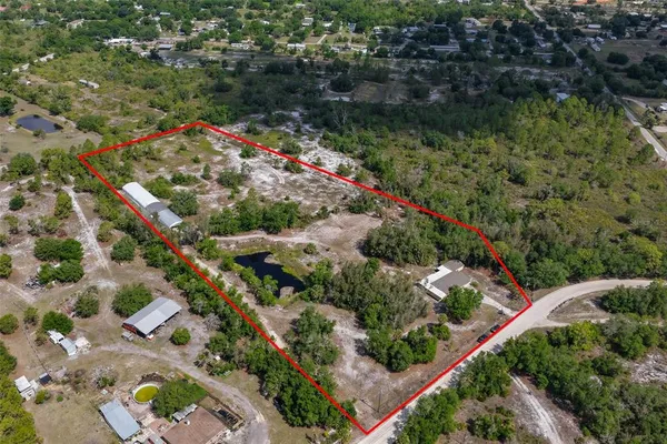 an aerial view of residential house and outdoor space