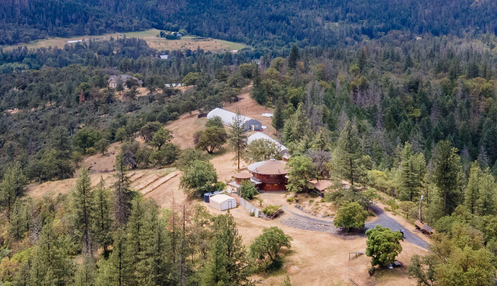 9595 Sterling Creek Road Jacksonville, OR 97530 - Photo 70 of 76 a view of a lot of trees and houses