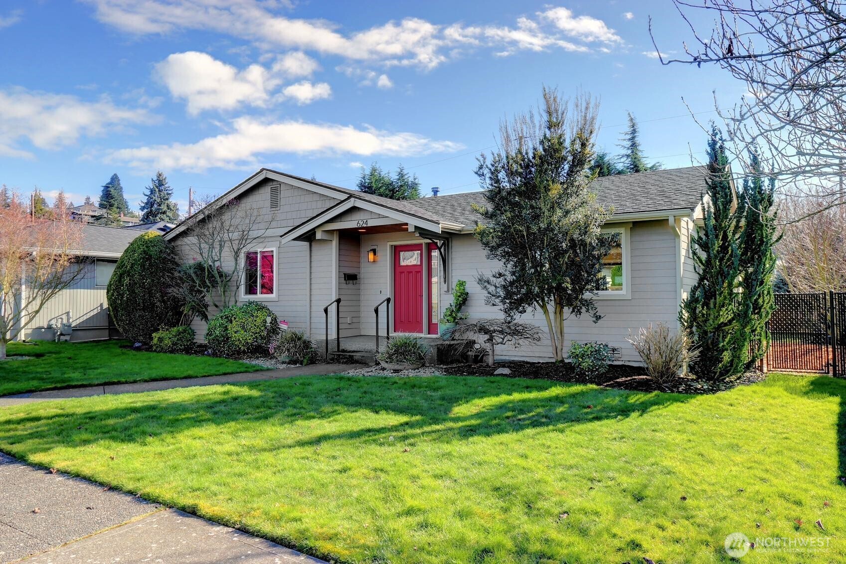 a front view of house with yard and green space