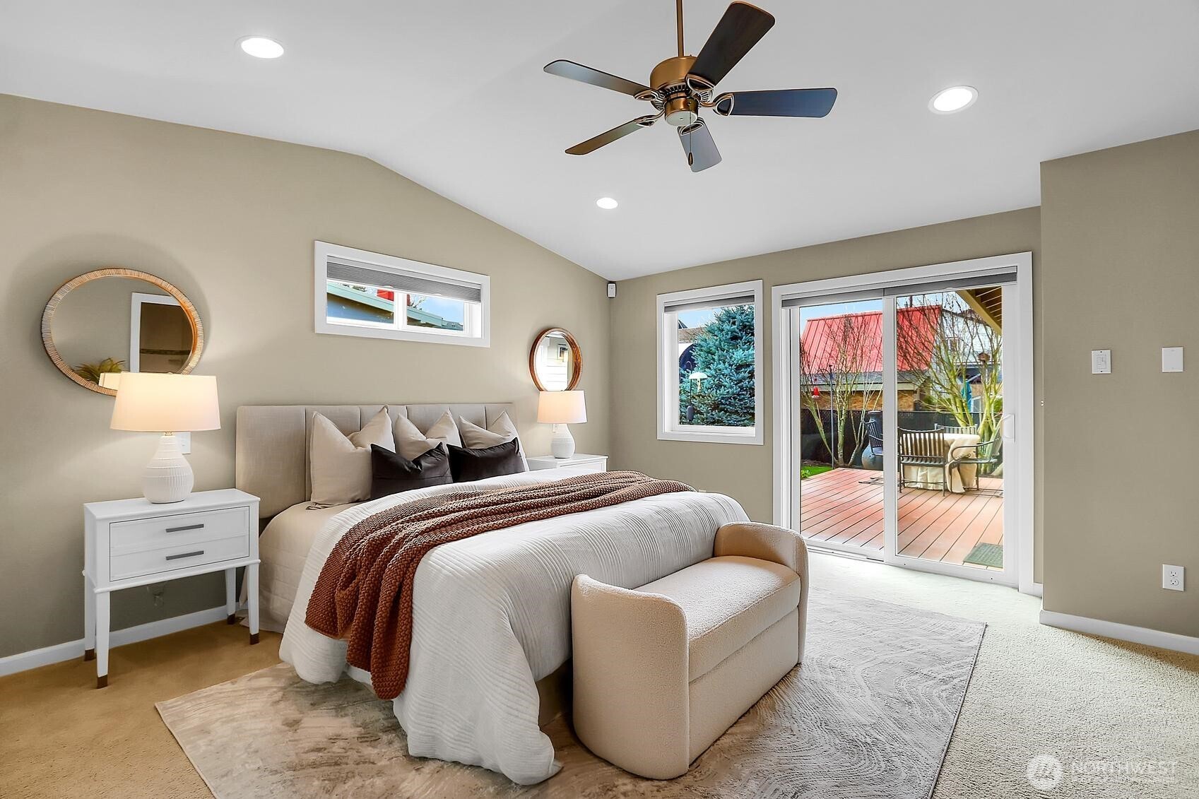624 Alder Street Edmonds, WA 98020 - Photo 13 of 23 a spacious bedroom with a bed a couch and a window