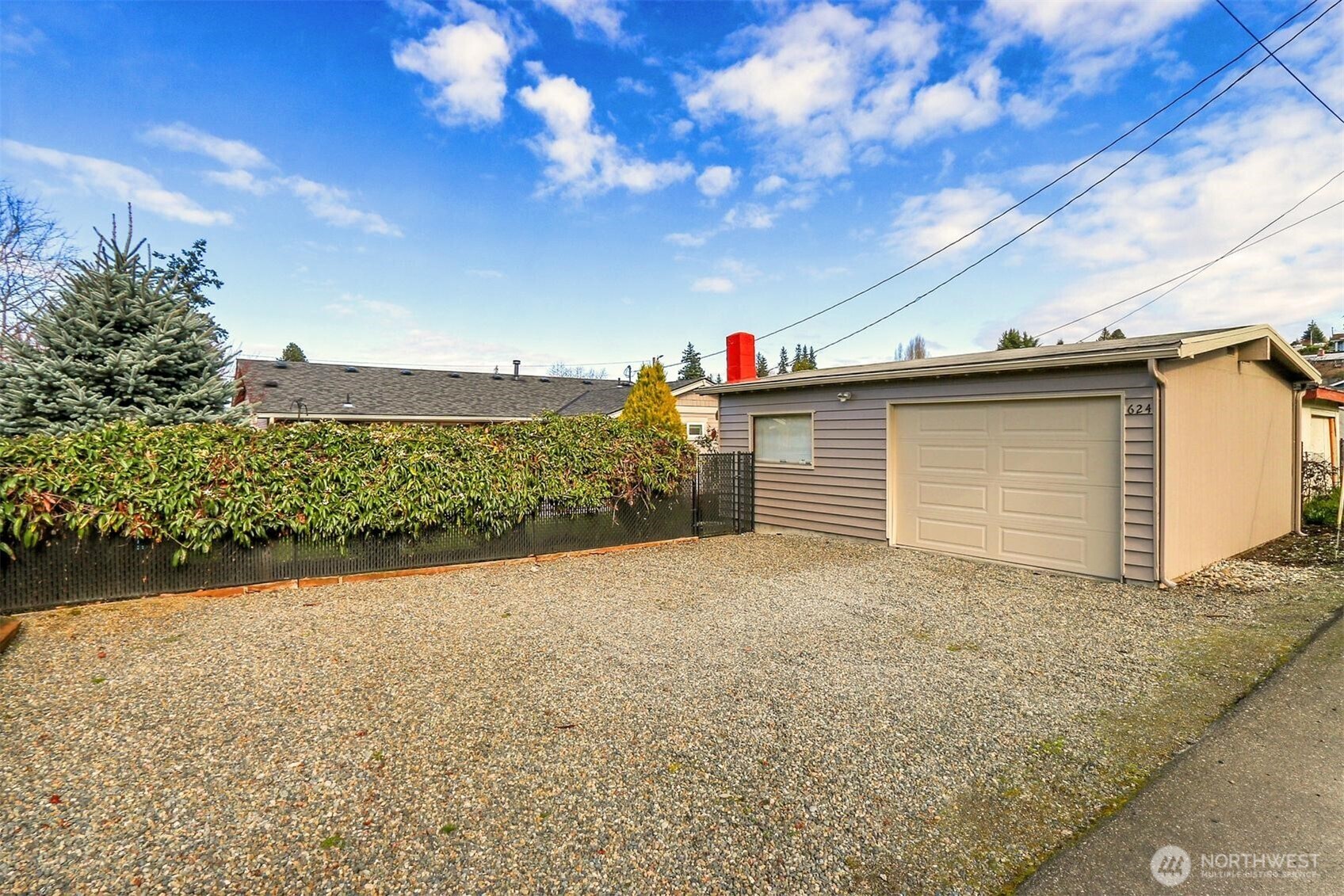 624 Alder Street Edmonds, WA 98020 - Photo 20 of 23 a view of a backyard of the house