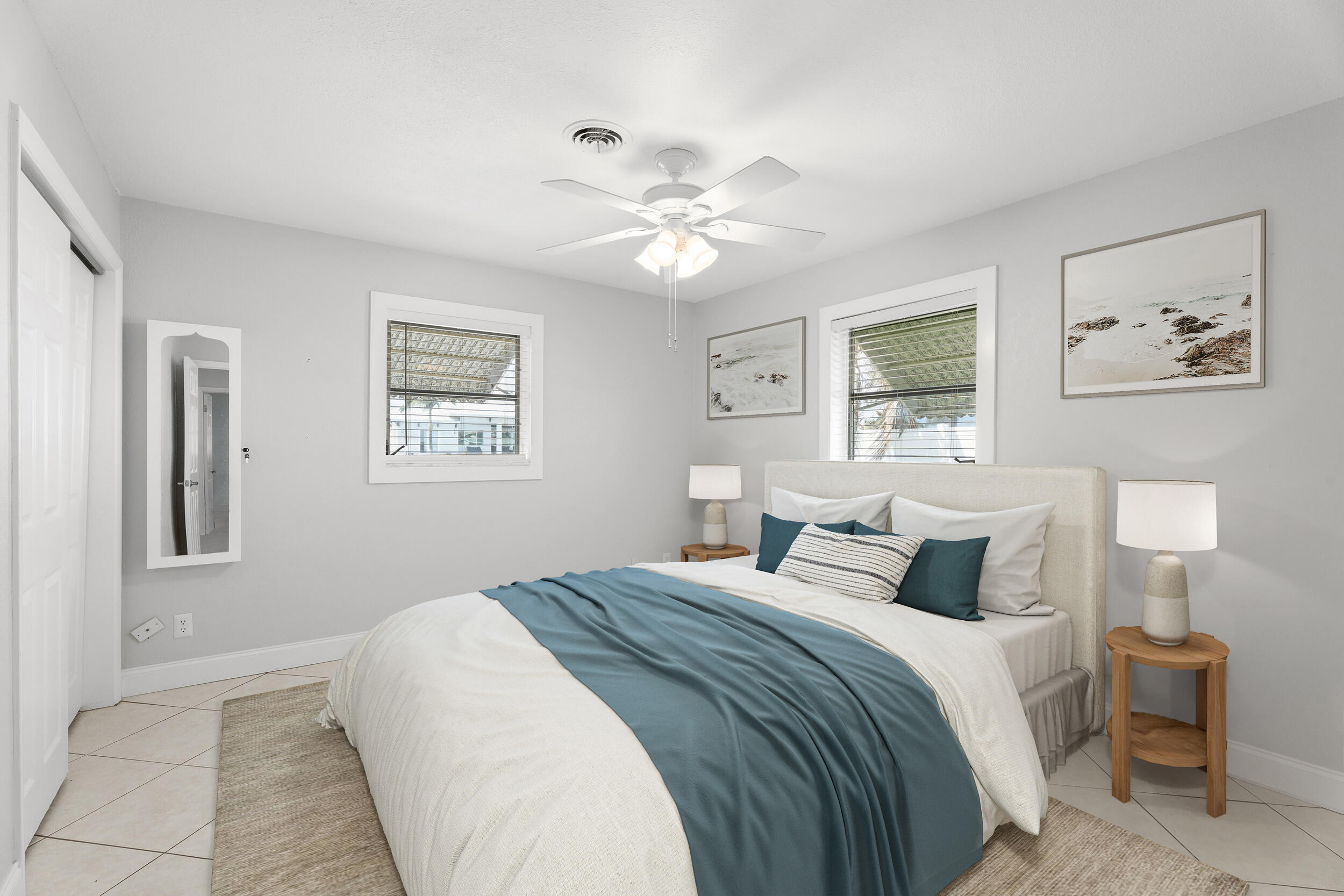 1459 Southwest Seahawk Way Palm City, FL 34990 - Photo 15 of 43 a bedroom with a large bed and a painting on the wall