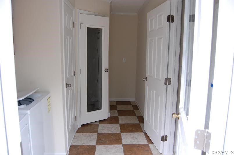 4052 Paynes Mill Road Bumpass, VA 23024 - Photo 6 of 17 a view of a hallway with a dining room and front door