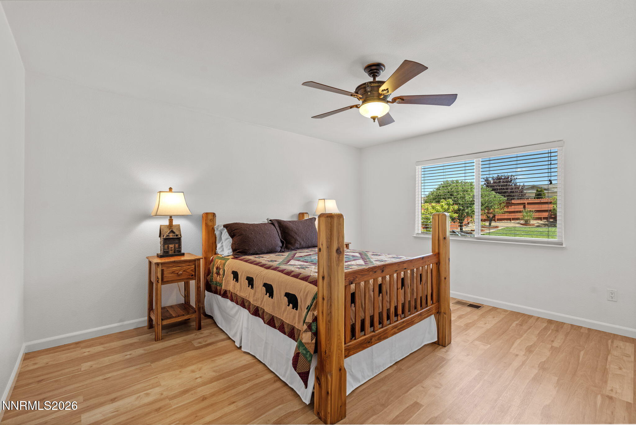 18324 Panda Bear Court Reno, NV 89508 - Photo 18 of 44 a view of bedroom with furniture and wooden floor