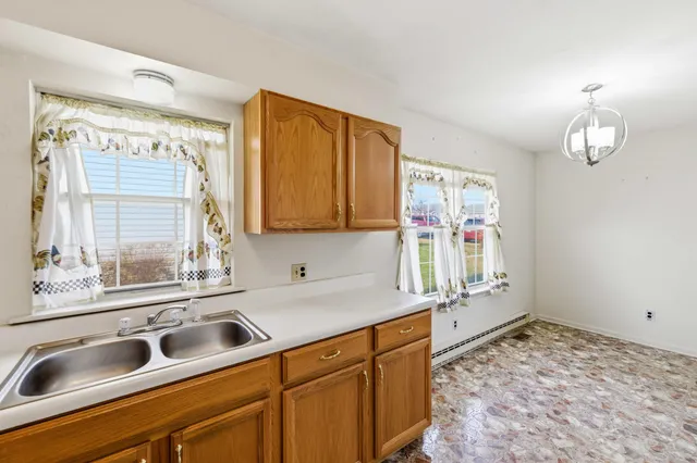a kitchen with a sink and a window