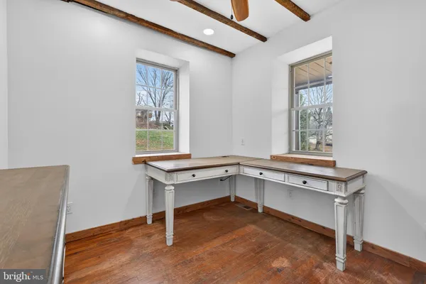 a room with gym equipment and a window