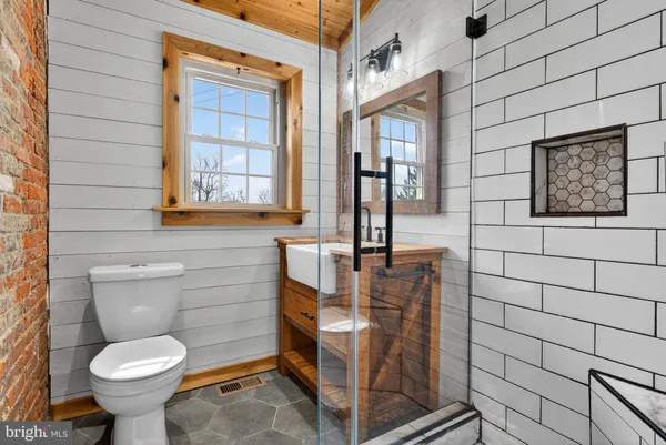 a room with a table a sink and a window