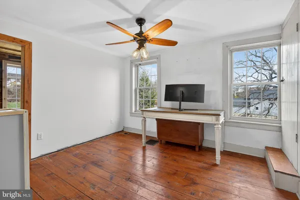 wooden floor in an empty room and a window