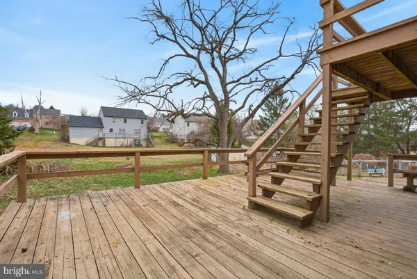 a view of a balcony with yard