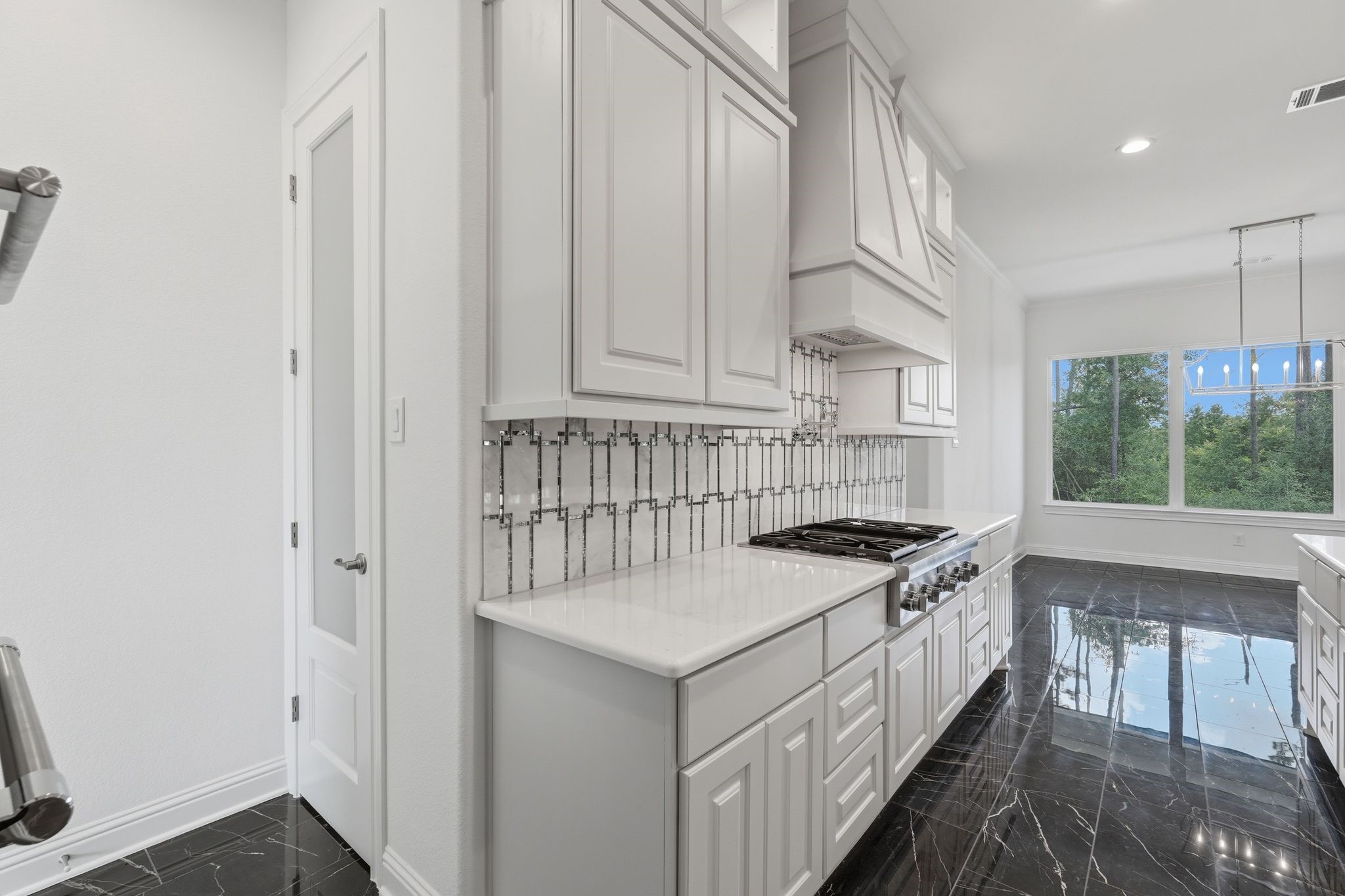 16081 Forest Mill Road Willis, TX 77378 - Photo 15 of 37 Imagine gathering with family and friends in this beautiful gourmet kitchen, where style, function, and exceptional craftmanship come together.