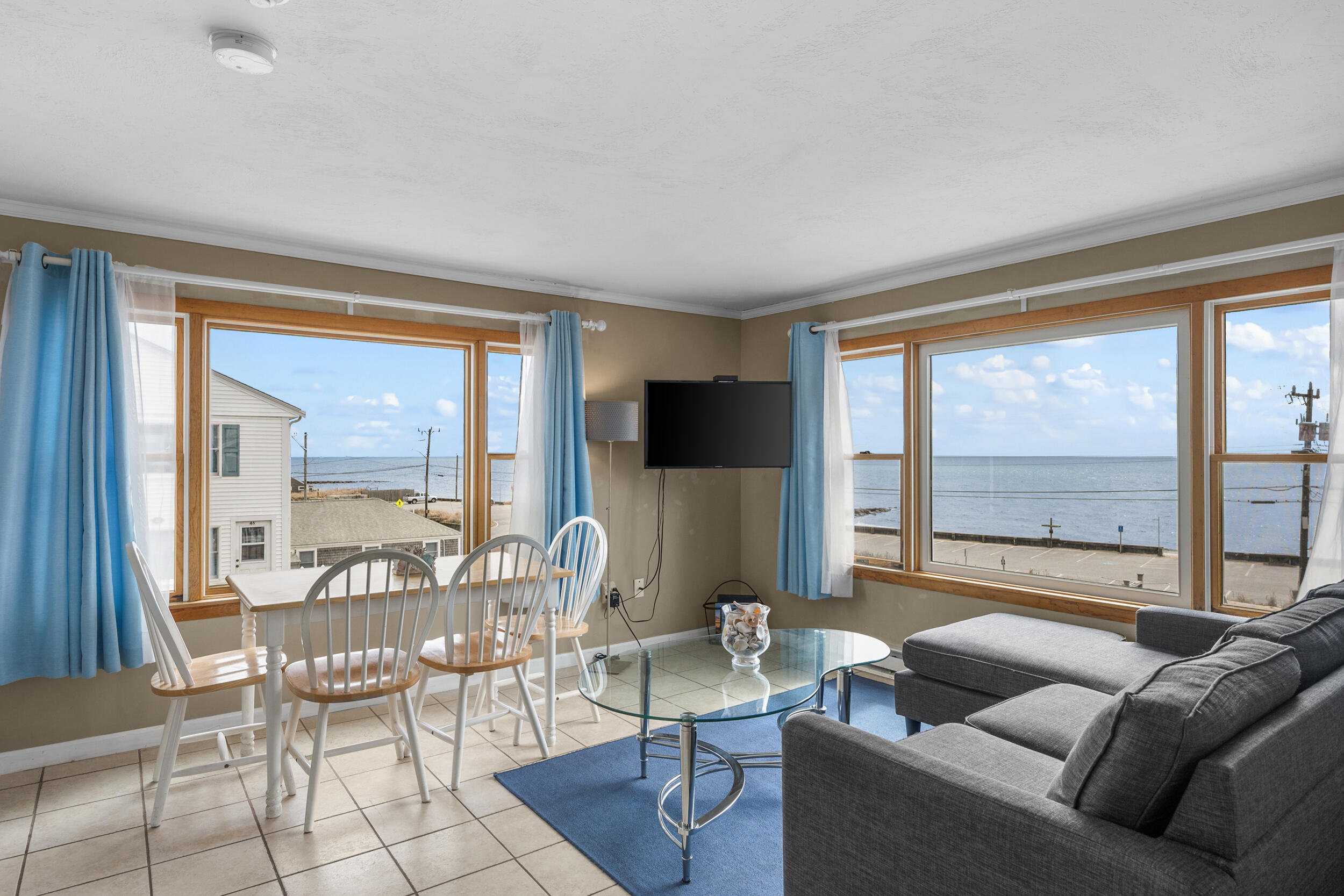 154 Old Wharf Road, Unit U14 Dennis Port, MA 02639 - Photo 11 of 32 a living room with furniture and a large window