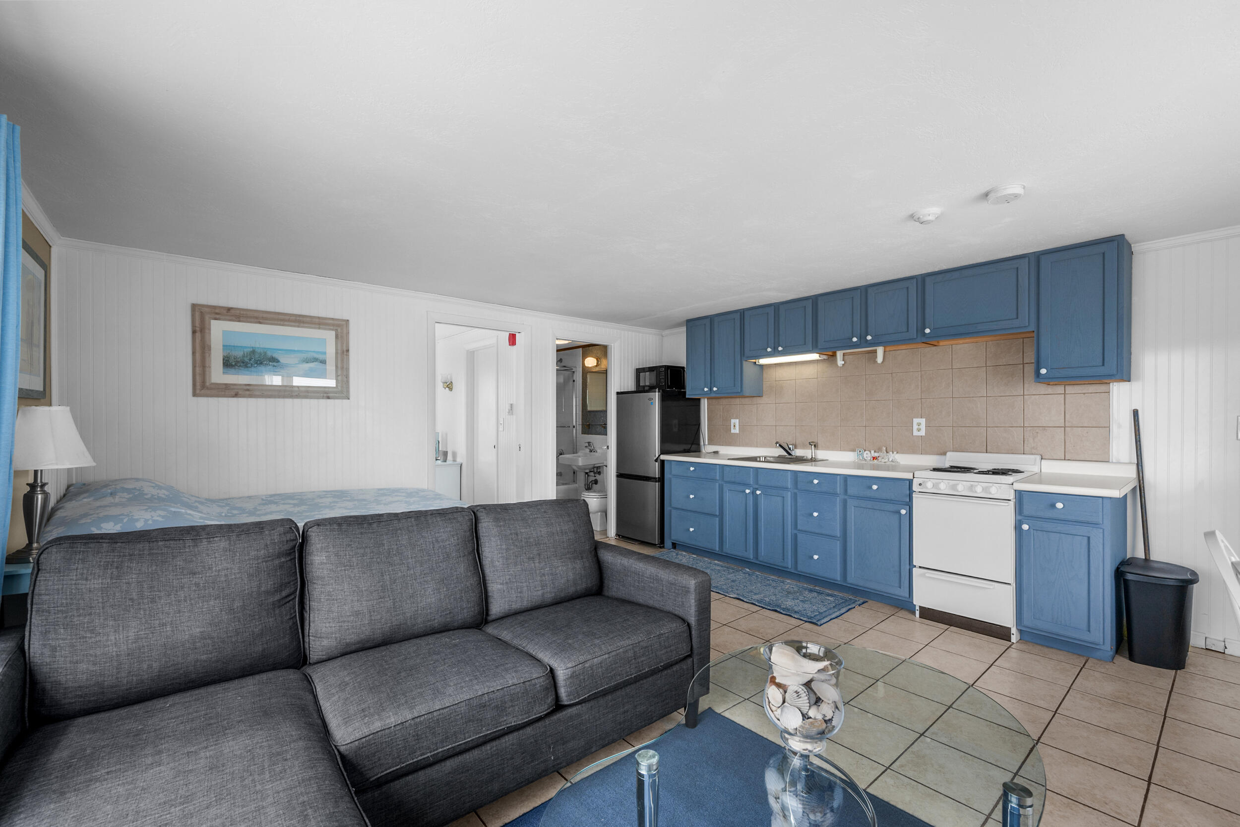 154 Old Wharf Road, Unit U14 Dennis Port, MA 02639 - Photo 15 of 32 a living room with granite countertop furniture and kitchen