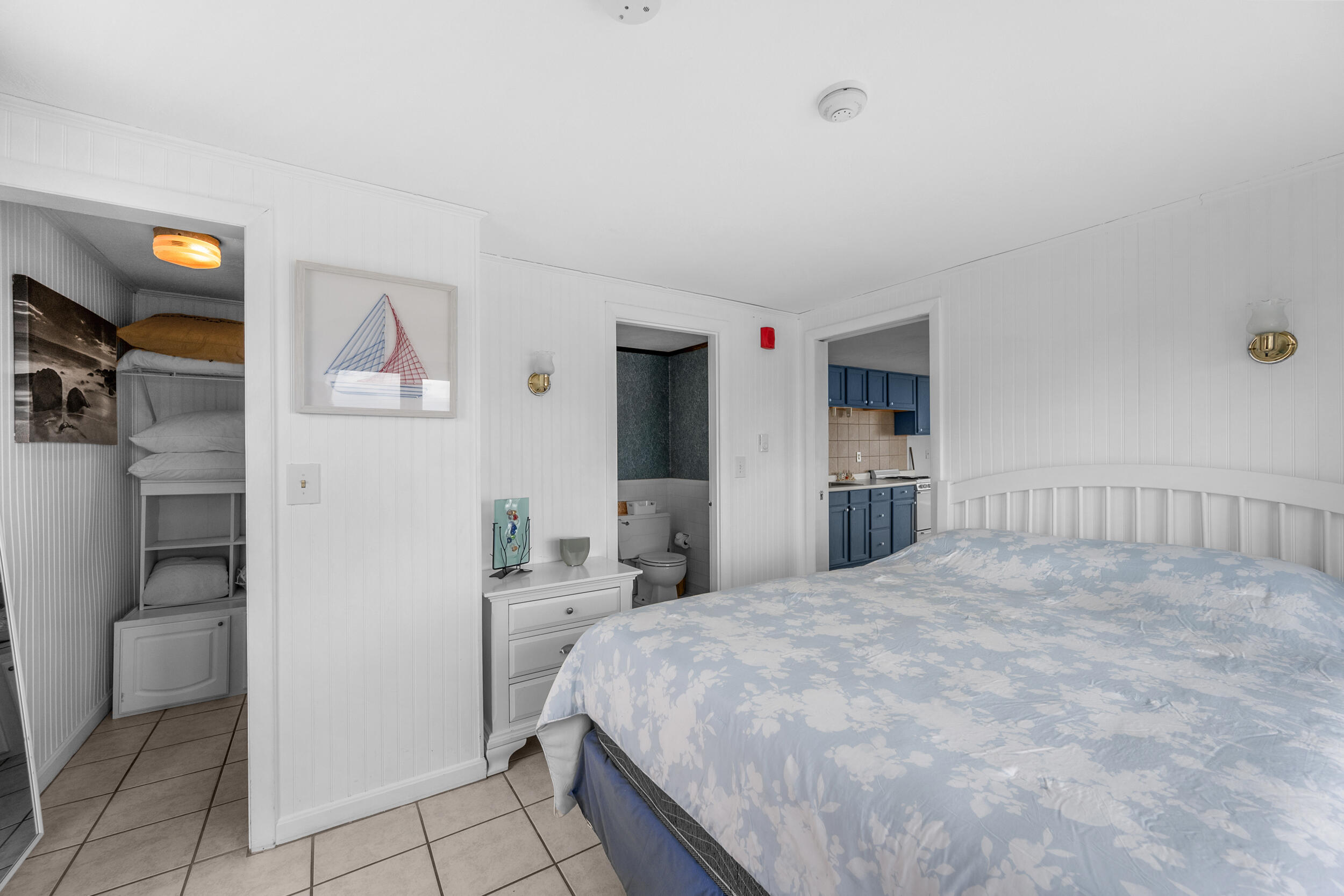 154 Old Wharf Road, Unit U14 Dennis Port, MA 02639 - Photo 21 of 32 a bedroom with a bed and cabinets