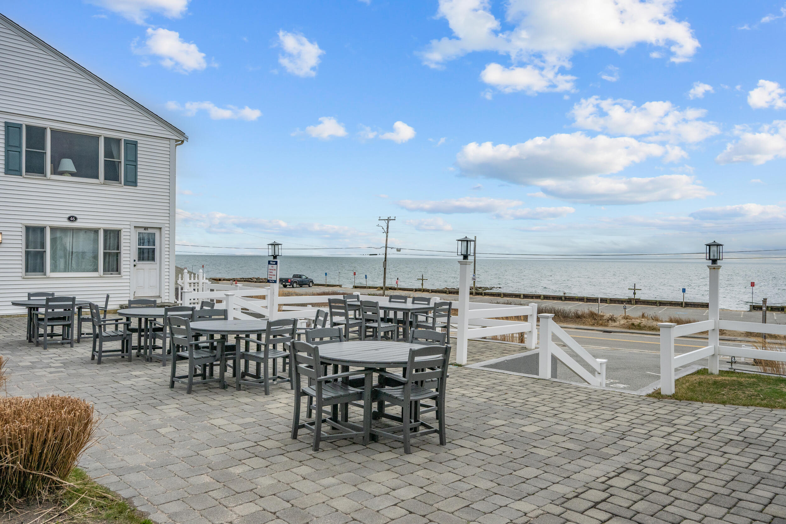 154 Old Wharf Road, Unit U14 Dennis Port, MA 02639 - Photo 27 of 32 a view of a roof deck with table and chairs