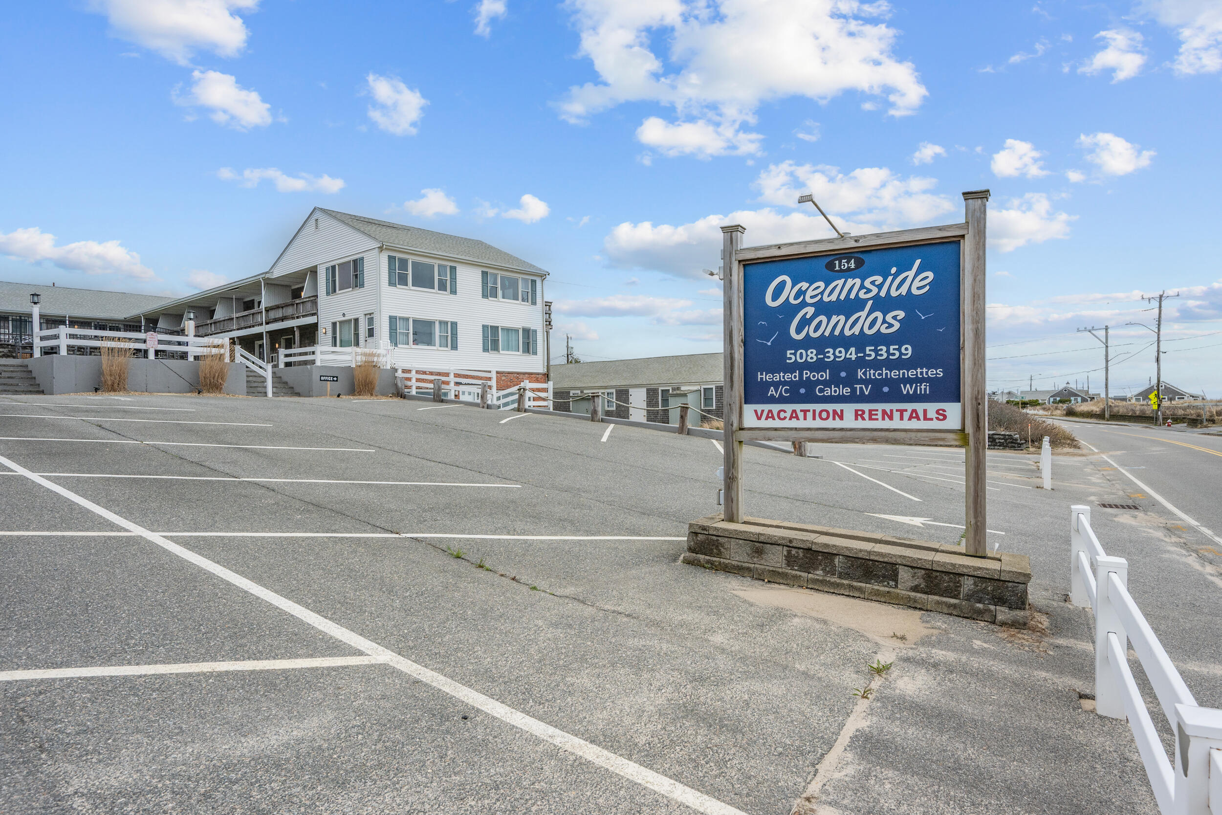 154 Old Wharf Road, Unit U14 Dennis Port, MA 02639 - Photo 29 of 32 a view of a building with parking