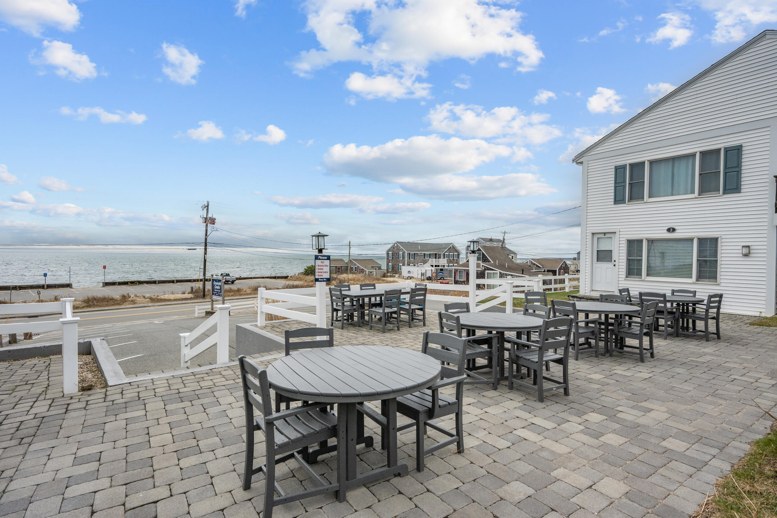 154 Old Wharf Road, Unit U14 Dennis Port, MA 02639 - Photo 6 of 32 a view of a patio with table and chairs