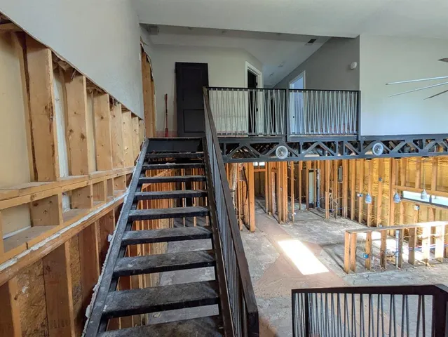 a view of an empty room with wooden walls