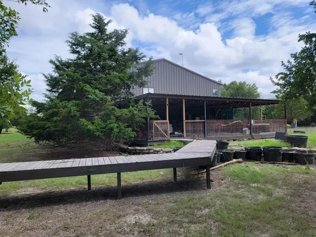 a view of patio with chairs and a yard