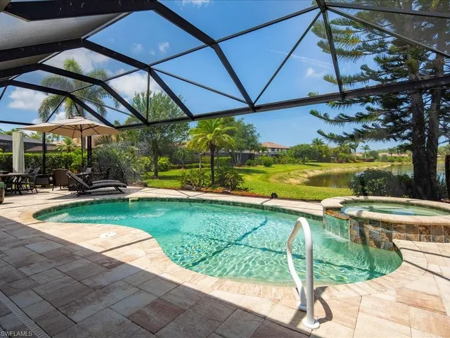 a view of a swimming pool with a patio