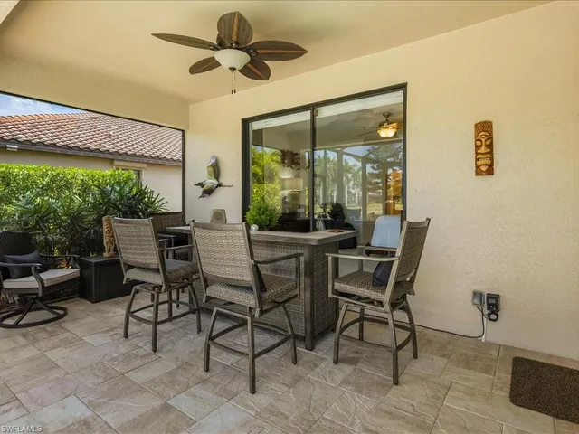 a dining room with furniture and a window