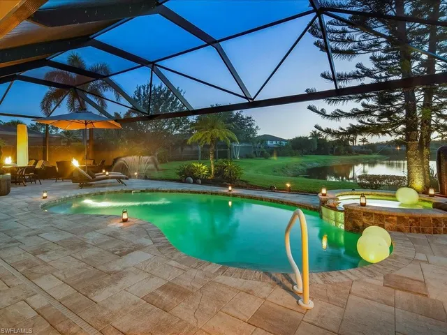 a view of a swimming pool with a patio