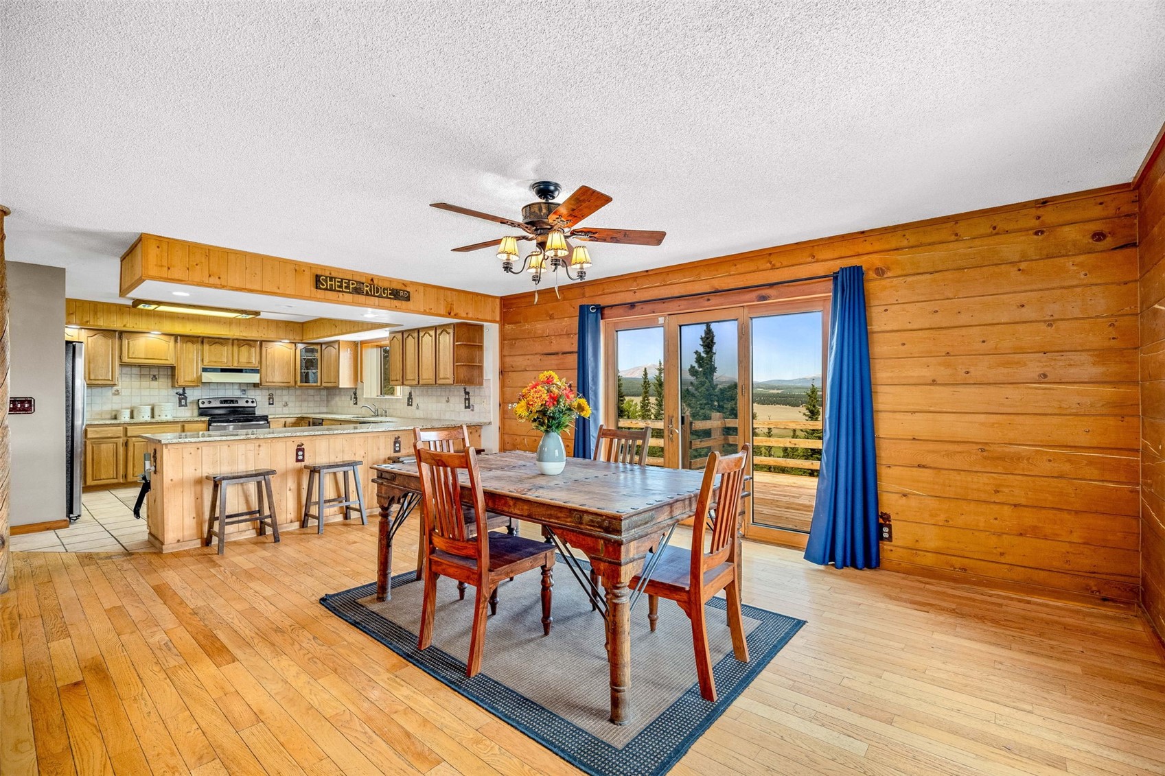 597 Sheep Ridge Road Fairplay, CO 80440 - Photo 11 of 50 a dining room with furniture garden view and wooden floor
