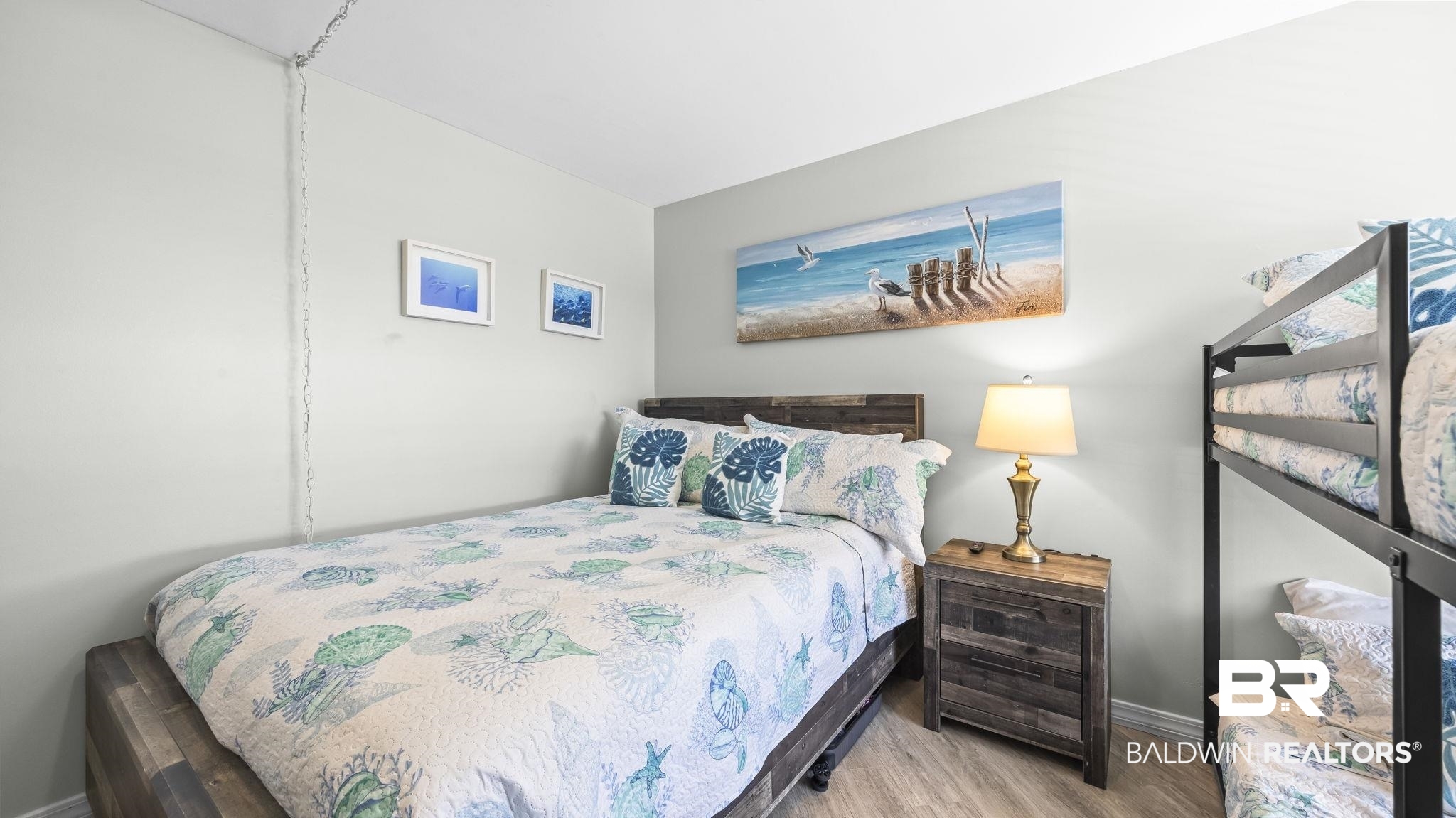 497 Plantation Road, Unit 1247 Gulf Shores, AL 36542 - Photo 14 of 29 Bedroom with baseboards and wood finished floors