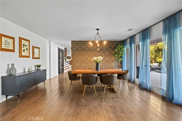 a bathroom with a double vanity sink a mirror and a bathtub
