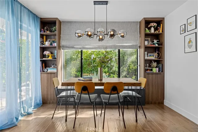 a living room with furniture a rug and a table