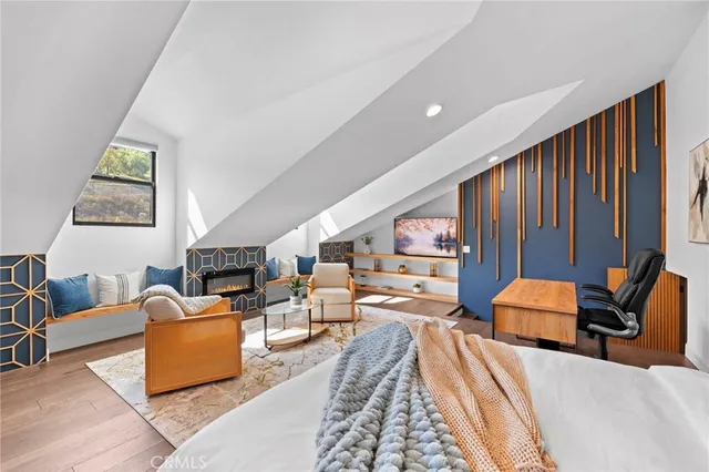 a bathroom with a granite countertop sink mirror vanity and toilet
