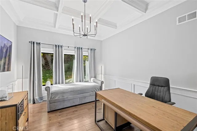 a front view of a house with swimming pool having outdoor seating